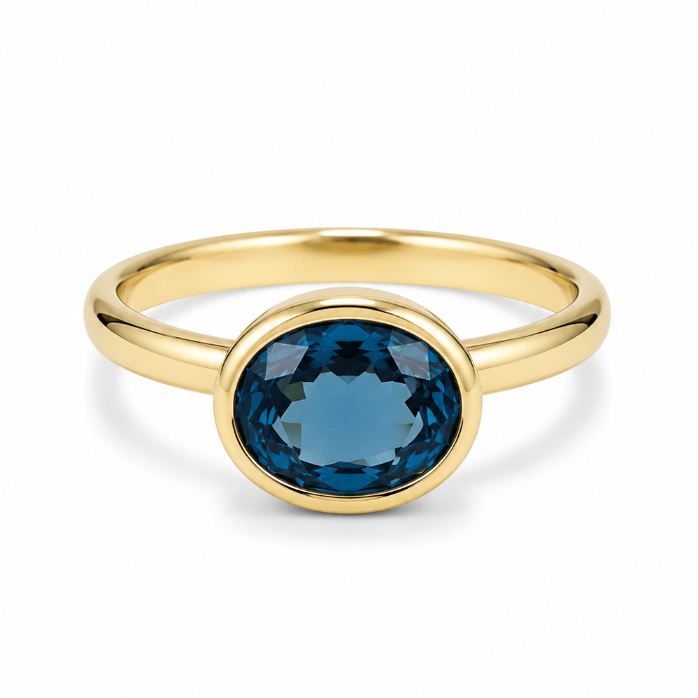 9ct Yellow Gold Bezel Set Oval London Blue Topaz Ring - Aurum Jewels