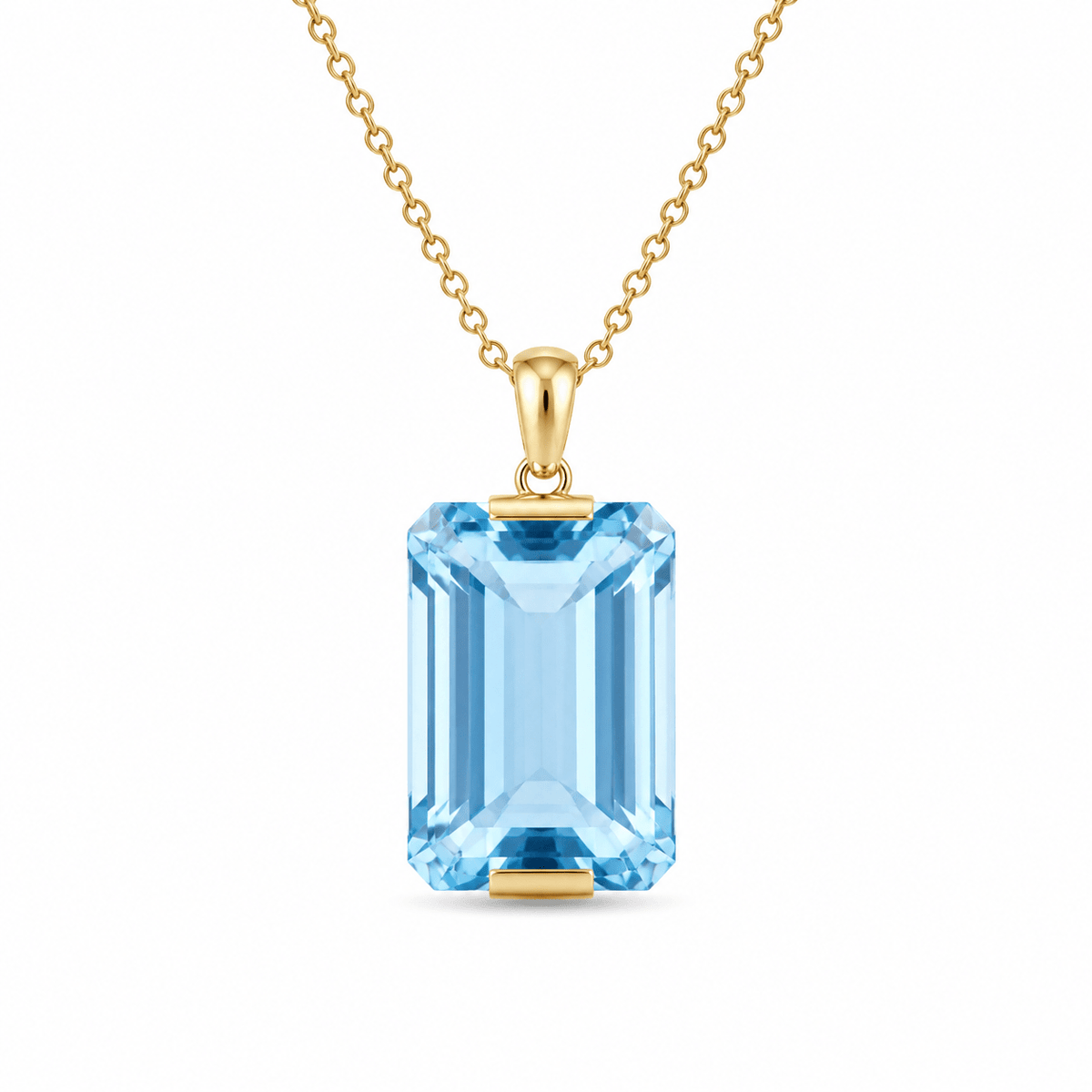9ct Yellow Gold 16x25mm Emerald Cut Blue Topaz Pendant - Aurum Jewels