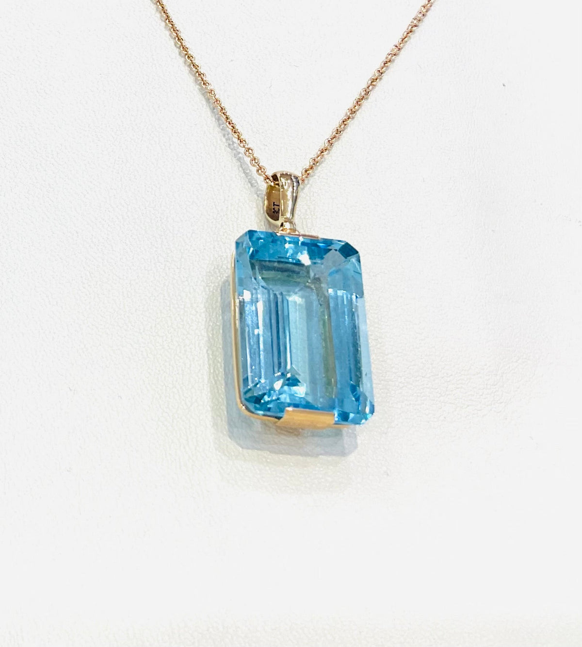 9ct Yellow Gold 16x25mm Emerald Cut Blue Topaz Pendant - Aurum Jewels