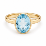 9ct Yellow Gold Bezel Set Oval Sky Blue Topaz - Aurum Jewels